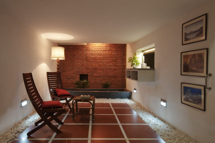 This unique room suspends a raised tile floor above white rock bed, for a serene, Zen garden feeling.