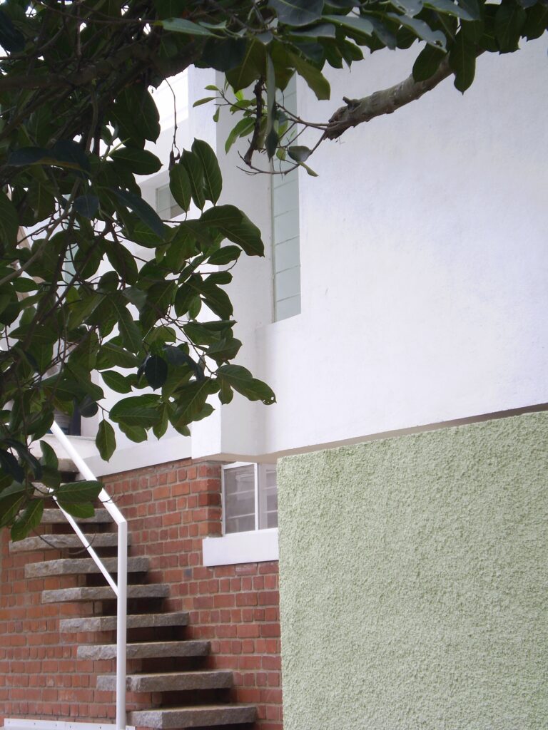 Side entry via floating stone stairway hides on left of the home.