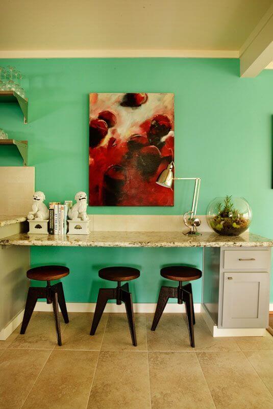 A lower counter between the dining room and the kitchen acts as both a study area and a breakfast counter.