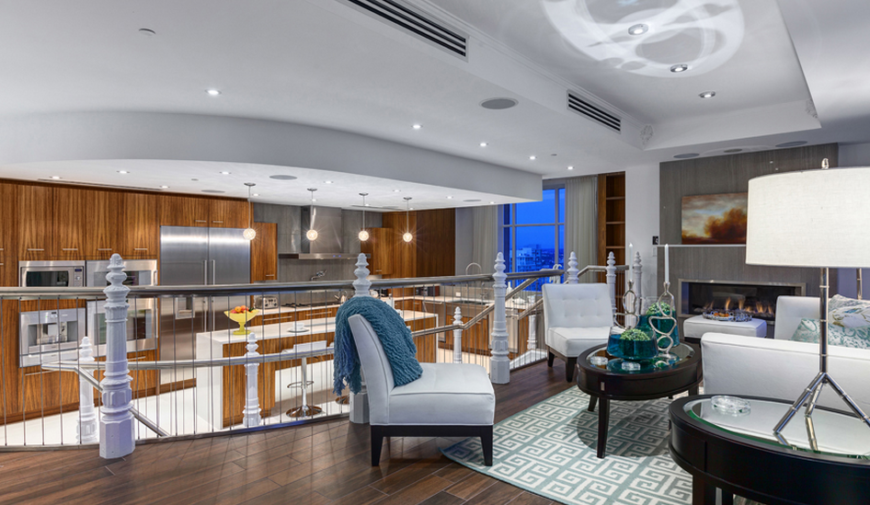 The gorgeous second floor living area of the Elysium penthouse boasts an open floor plan and beautiful woodwork.