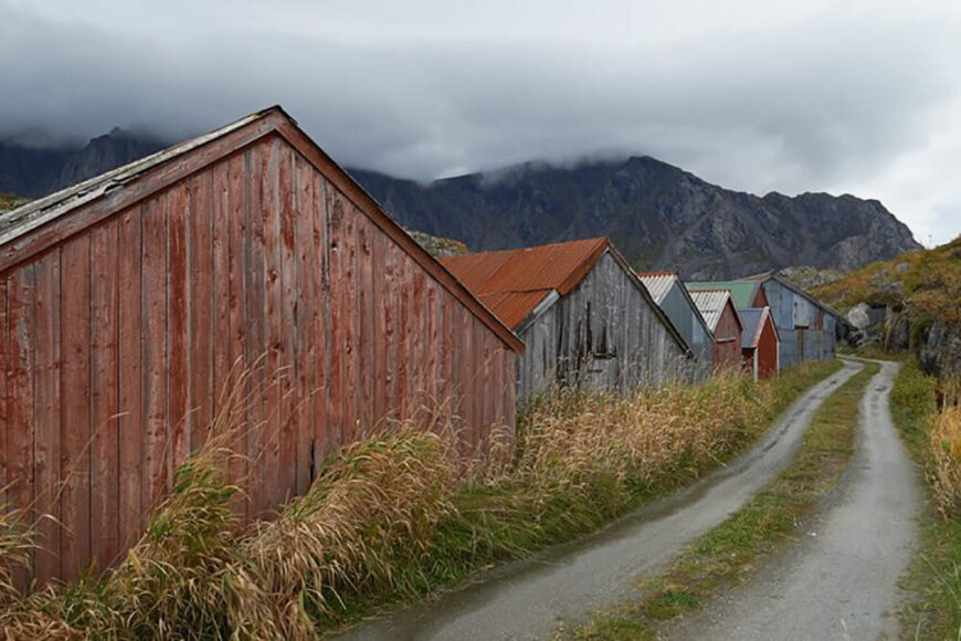 The narrow road leading to the home is dotted with similarly muted homes, in a variety of colors that help them stand out amidst the harsh landscape.