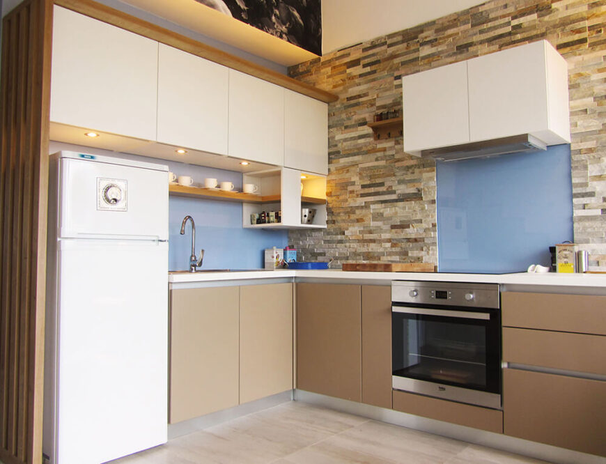 The expanded kitchen has room for all the appliances and the space where the stove used to be has been transformed into a closet.