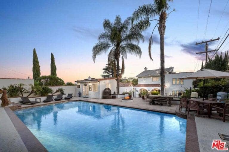 The swimming pool mirrors the beautiful Los Angeles skies.