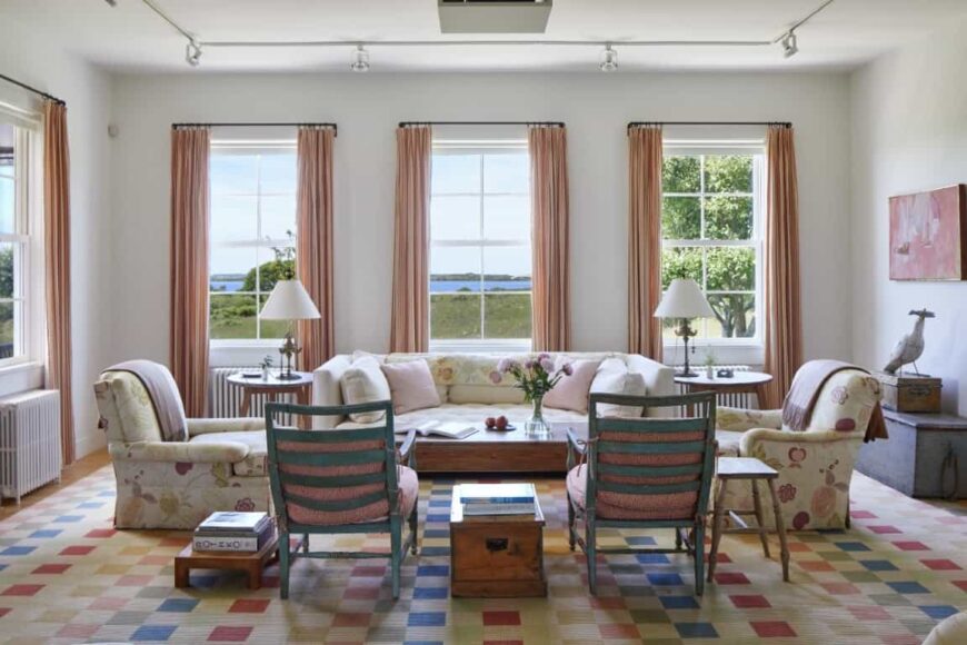 The formal living room looks lovely, featuring a nice sofa set on top of a massive colorful area rug. Images courtesy of Toptenrealestatedeals.com.