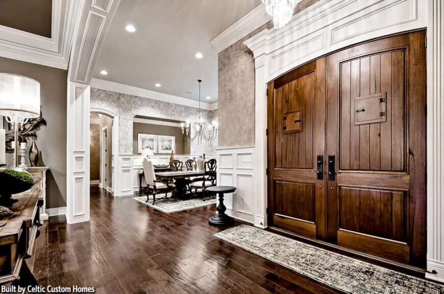 The formal dining room sits next to the foyer while the living area is just across.