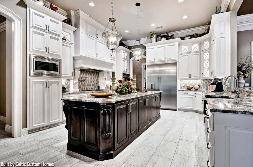 White cabinetry and a cooking alcove accented with an eye-catching mosaic backsplash completed the kitchen.