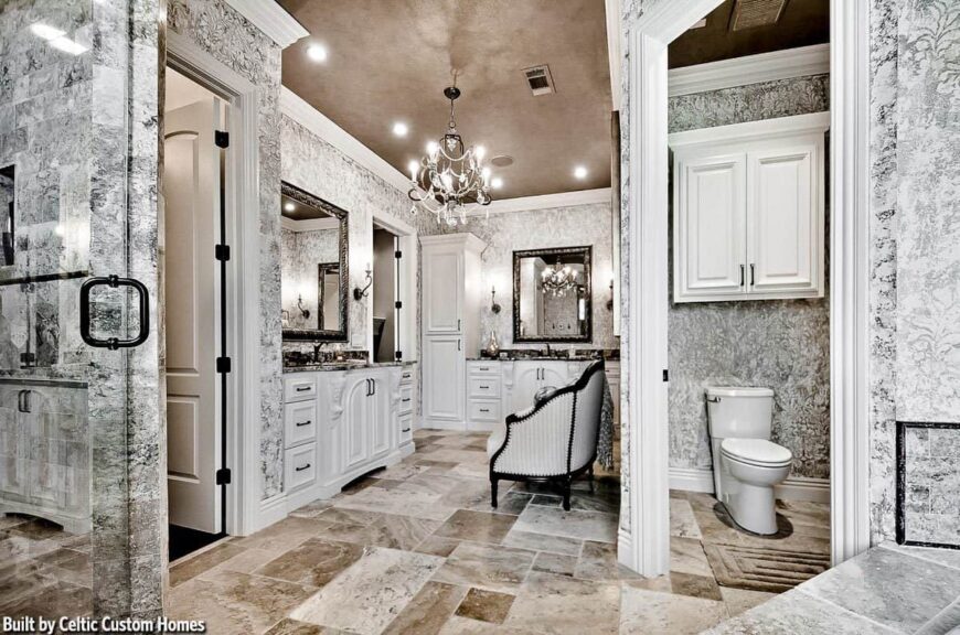 A farther view shows another sink vanity and the water closet behind the classy sofa.