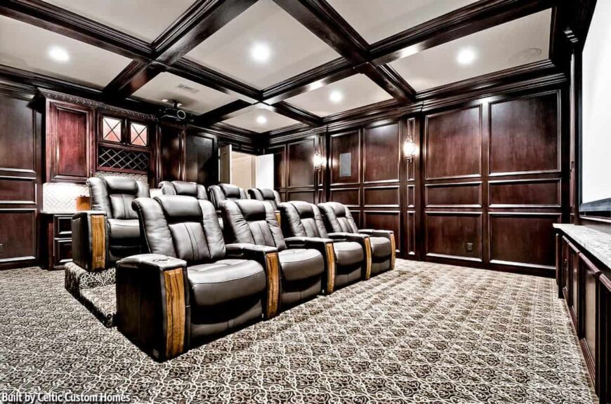 The opposite view shows the black leather recliners in front of the wet bar.