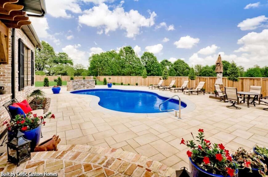 One last look at the sparkling pool complemented with beige loungers and a stone curved bar.