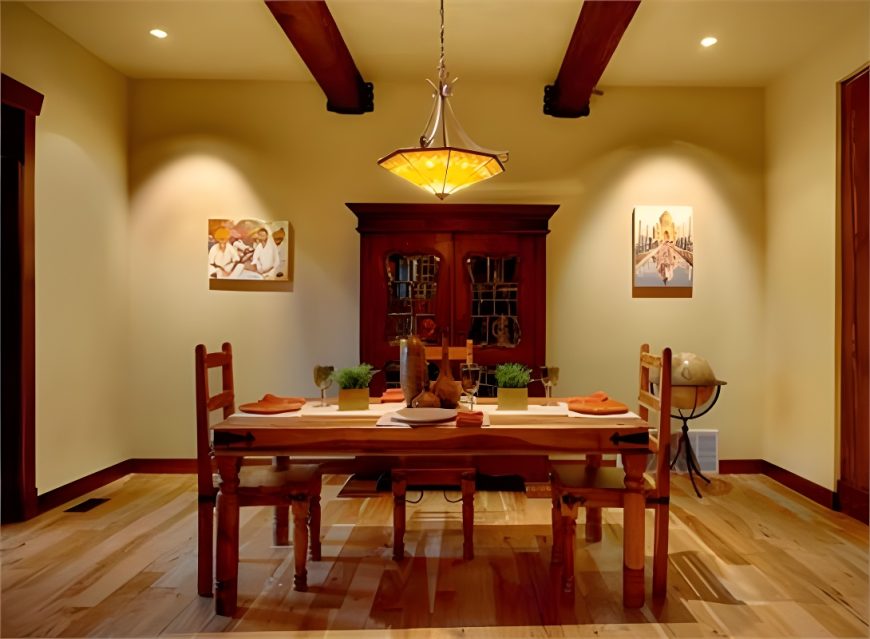 Formal dining room with dark wood china cabinet, rectangular dining set, and a glass dome pendant hanging from the beamed ceiling.