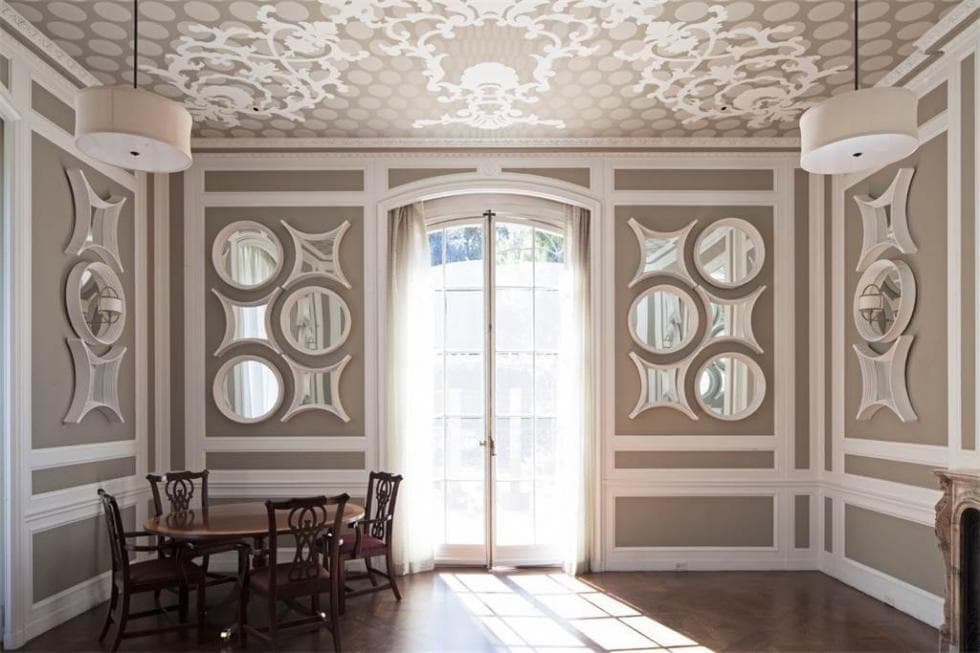 This other dining room has a more informal breakfast nook vibe to it. with a small wooden dining set that is complemented by the surrounding detailed walls. Image courtesy of Toptenrealestatedeals.com.