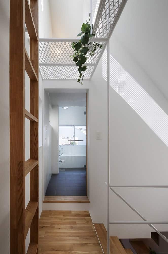 This is a look at the hallway from the vantage of the bedroom door. You can see more of the wooden ladder on the side.