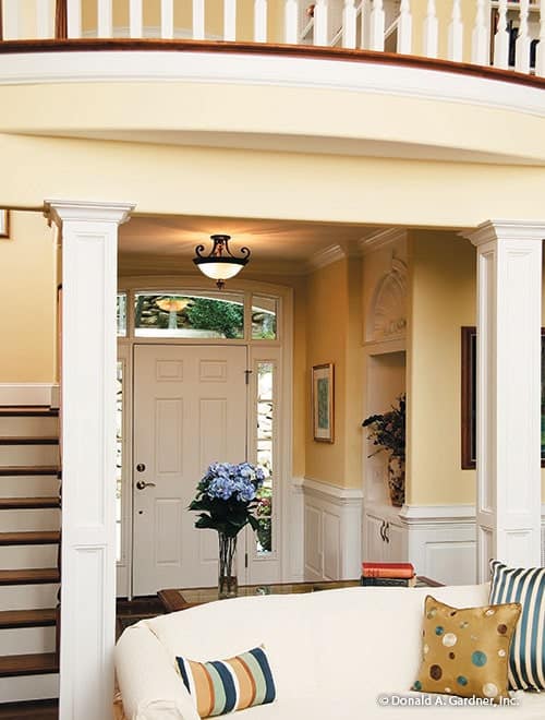 Foyer with a white entry door, glass dome pendant, and a display niche.