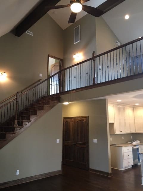 The wooden staircase on the side takes you to the balcony loft.