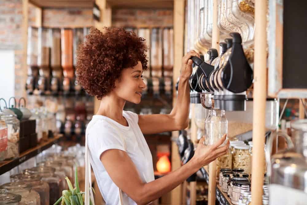 A woman buying her grains in a plastic-free store.