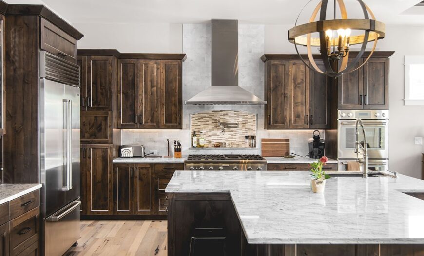 An oversized spherical chandelier helps brighten the kitchen.