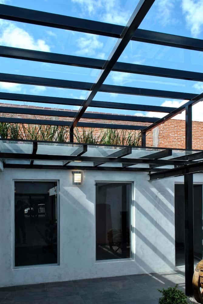 This is another look at the glass beams of the courtyard glass ceiling that is also used as decorative trellises above the glass windows.