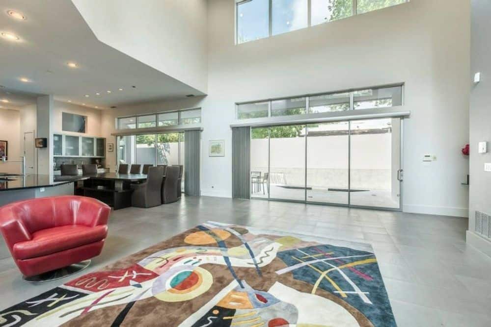 Oversized sliding glass doors extend the living space onto the veranda.