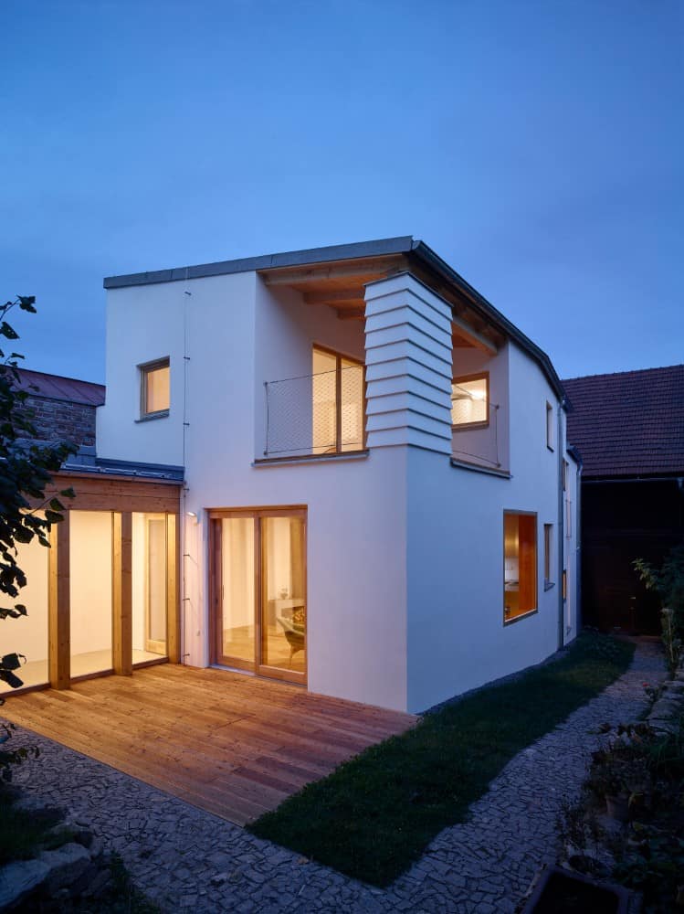 A stunning twilight shot of house in the courtyard.