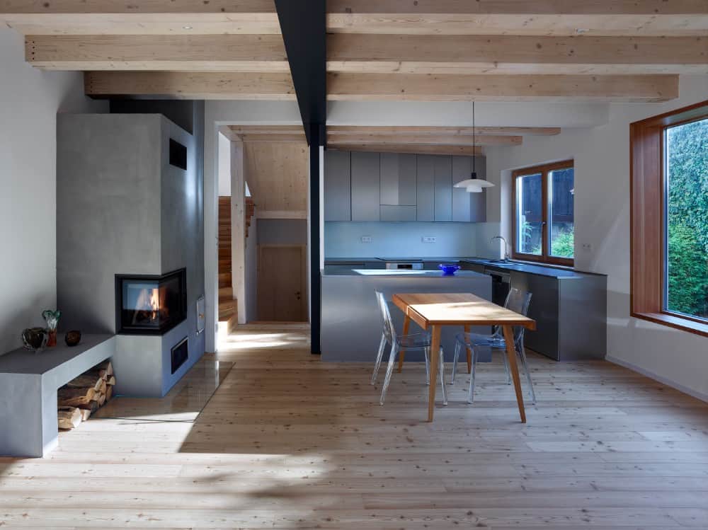 Interior shot of kitchen area showing its opened beam and gray kitchen accent.