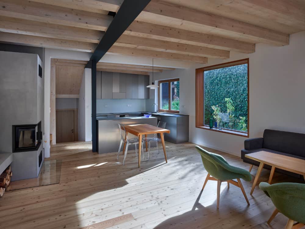 Interior shot of kitchen area showing its opened beam and gray kitchen accent.