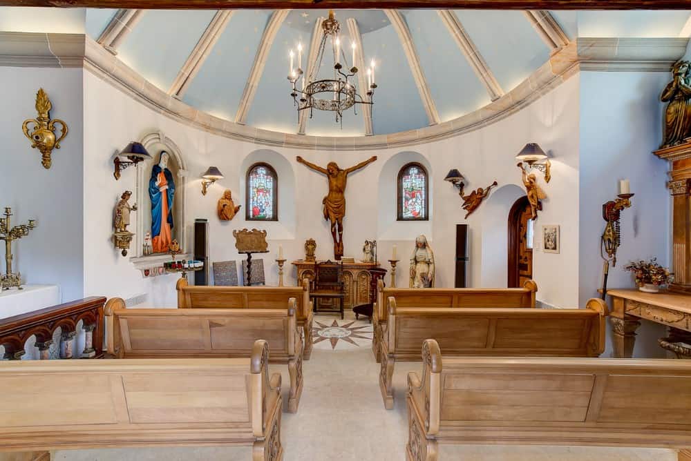 Chapel with loads of artifacts and an illuminated domed ceiling. Image courtesy of Toptenrealestatedeals.com.