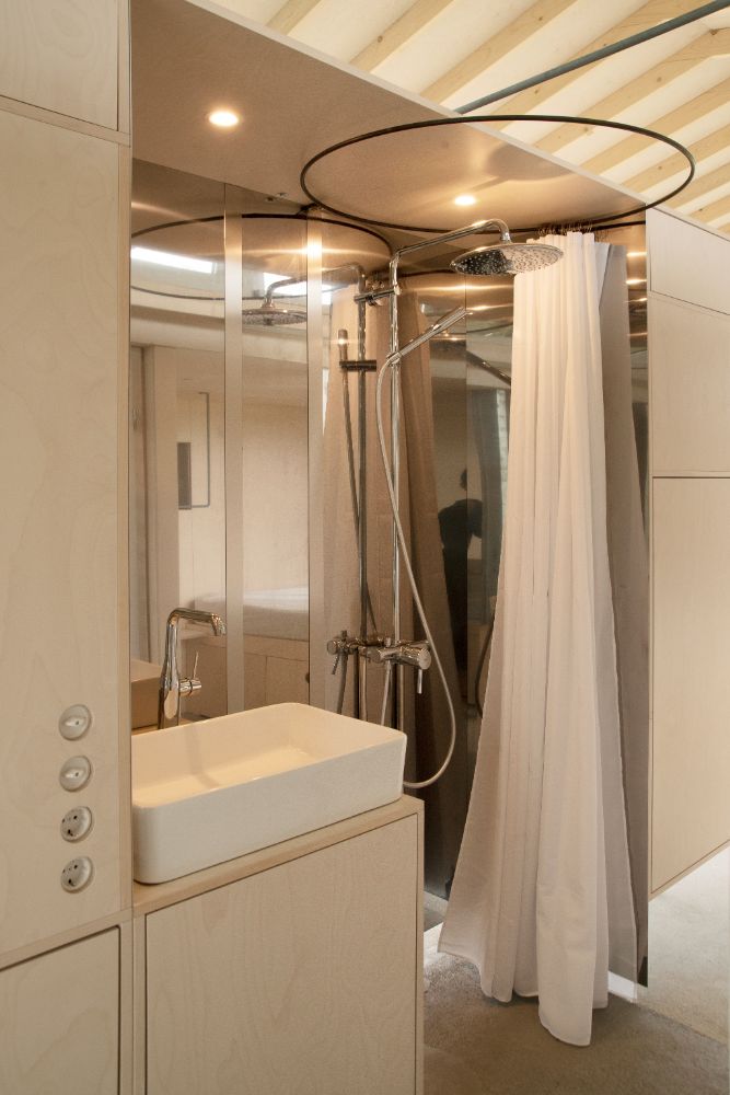 Bathroom with table-top rectangular sink and full length mirror.