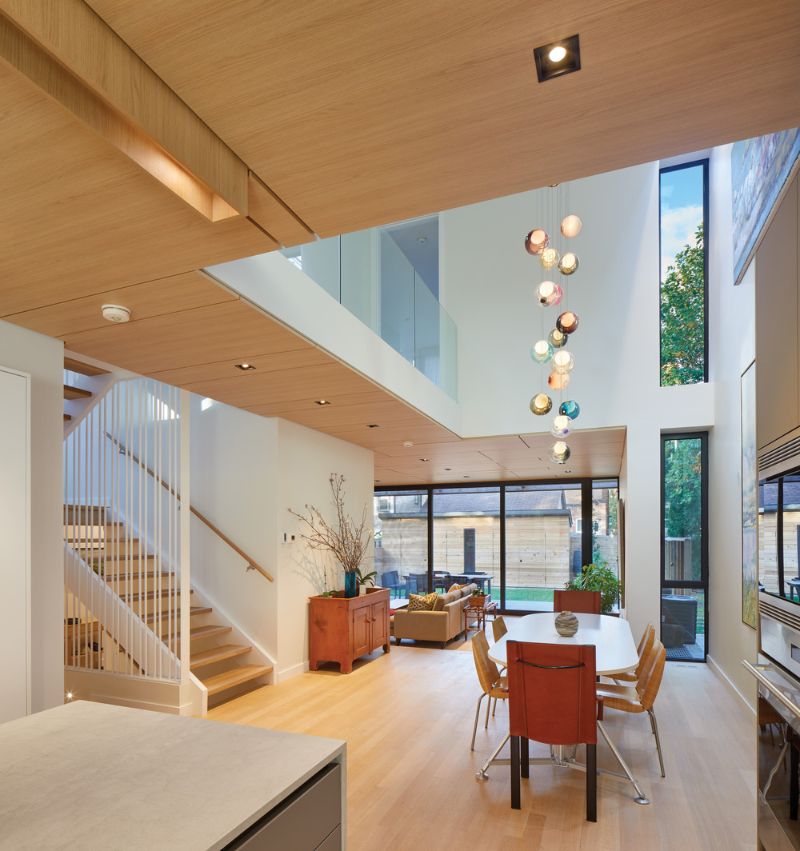 Robert street residence dining area with skylit atrium in a natural light.