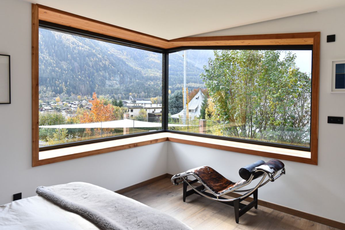 The bedroom area with two sided wide bay window allowing to view the courtyard.