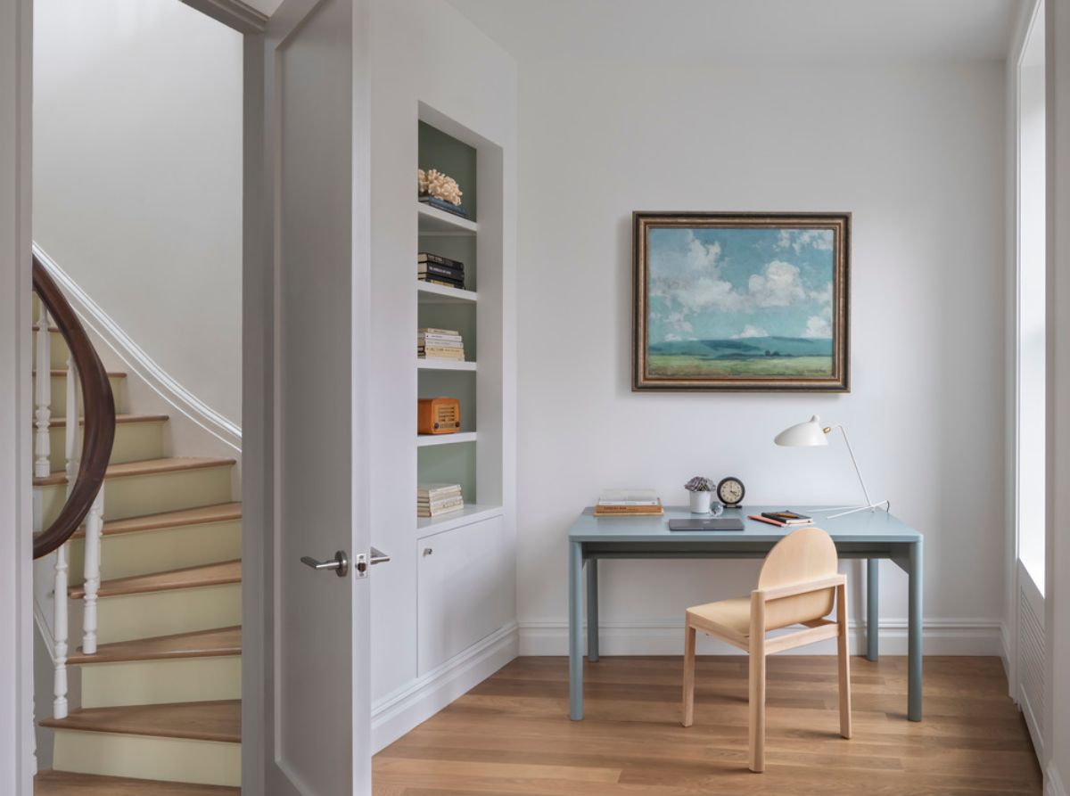 The second-floor curve stairs and a work-from-home space with a view of the street.