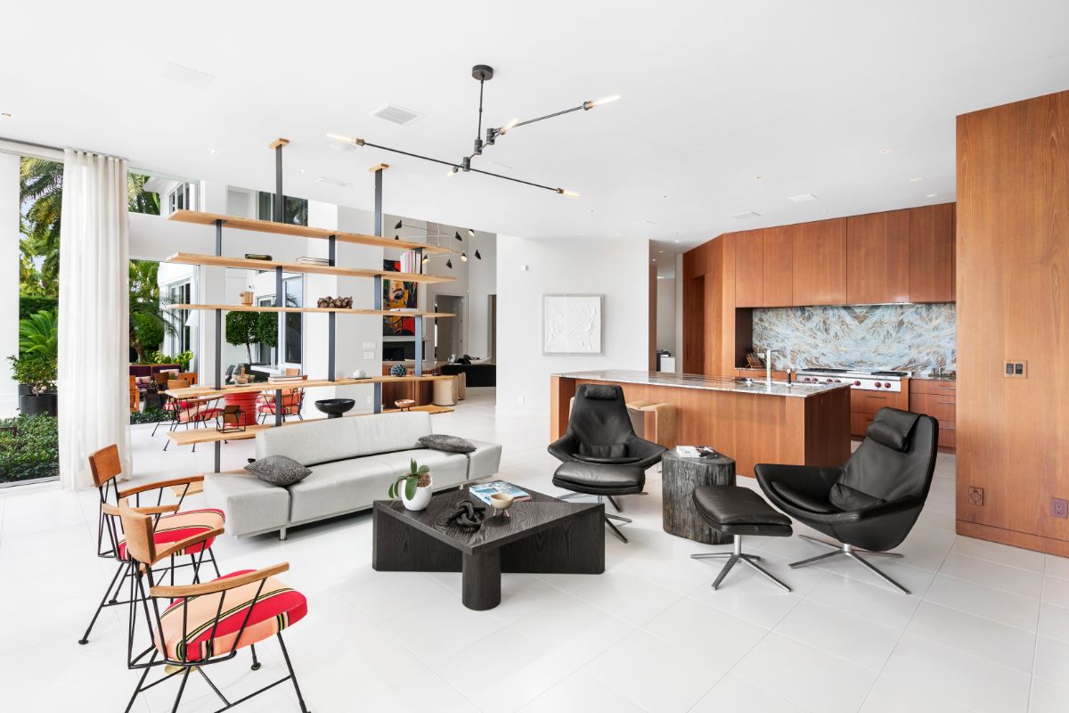 Family room with customized chairs, shelves and mini kitchen area.