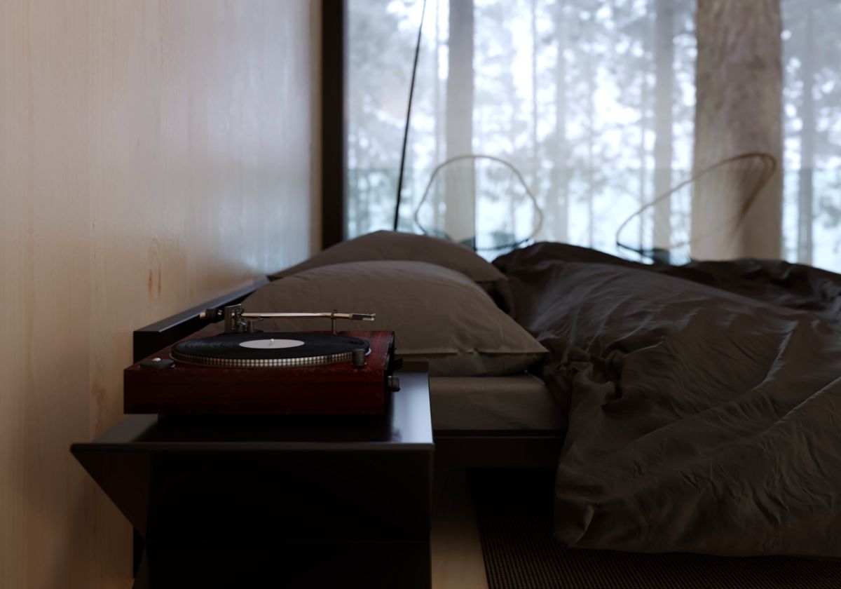 The light interior bedroom with a classic joke box on side table.