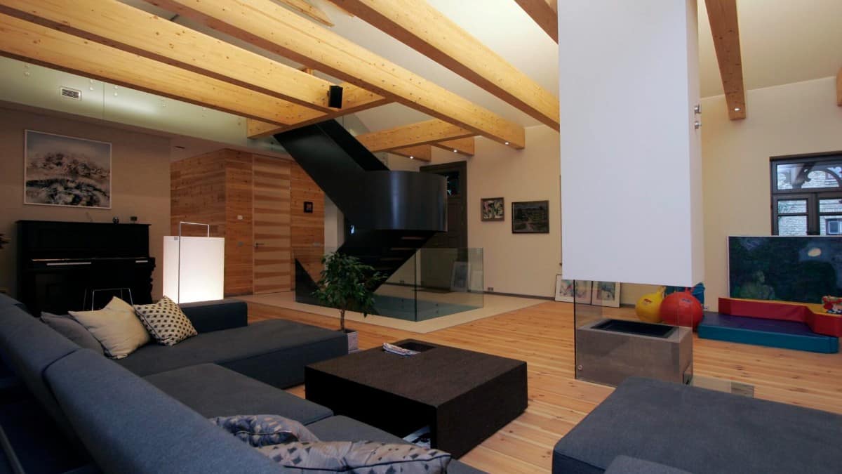 The house living room that features a cozy hardwood floor and dark wood furnishings.