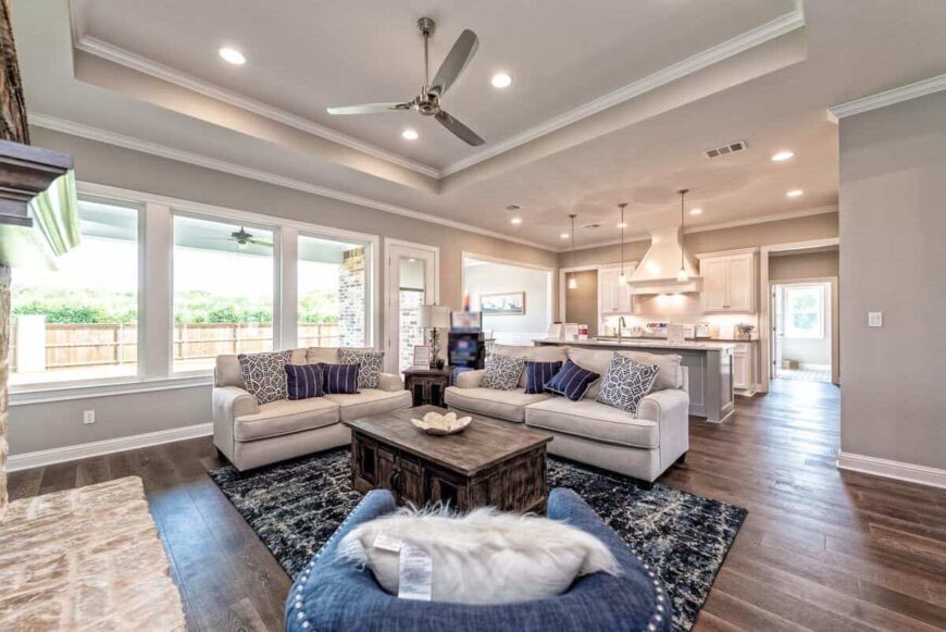 The bright family room opens completely to the kitchen.