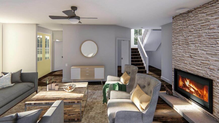 Across the living room is the foyer furnished with a light wood console table.