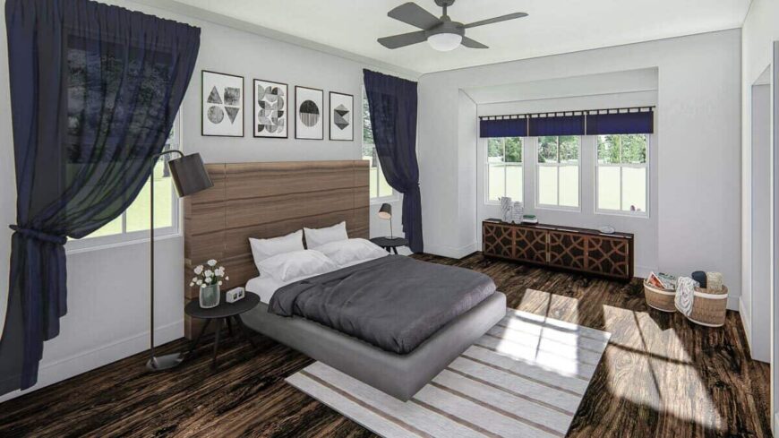 Primary bedroom with a boxed bay window and a comfy platform bed paired with a custom headboard.