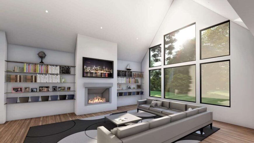 The great room includes a TV and a fireplace flanked by floating shelves.