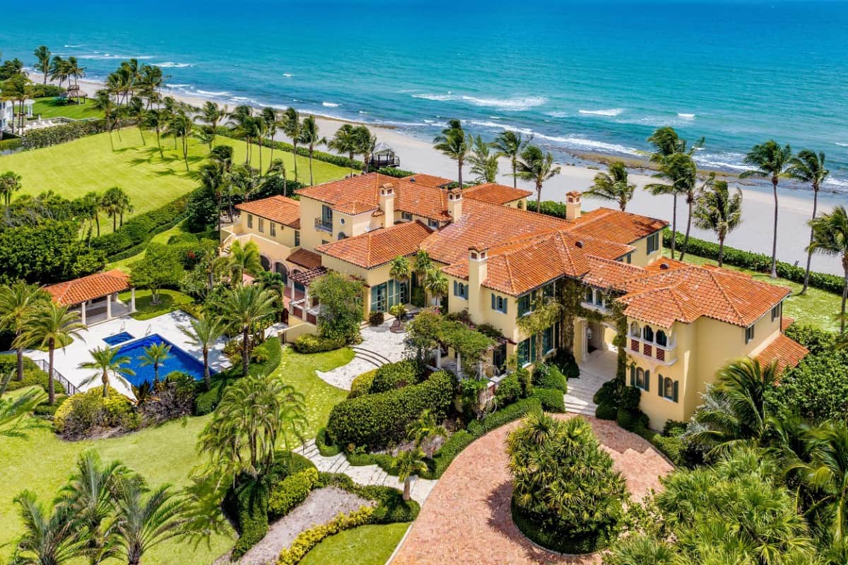 Aerial view of the mansion showcasing its outdoor spaces graced by serene landscaping. Image courtesy of Toptenrealestatedeals.com.