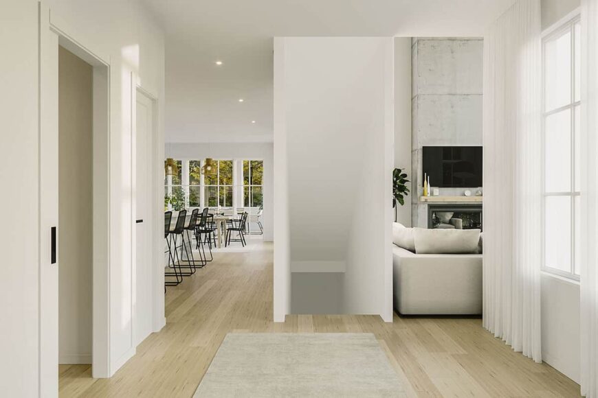 Foyer with wide plank flooring and a staircase leading down the basement.