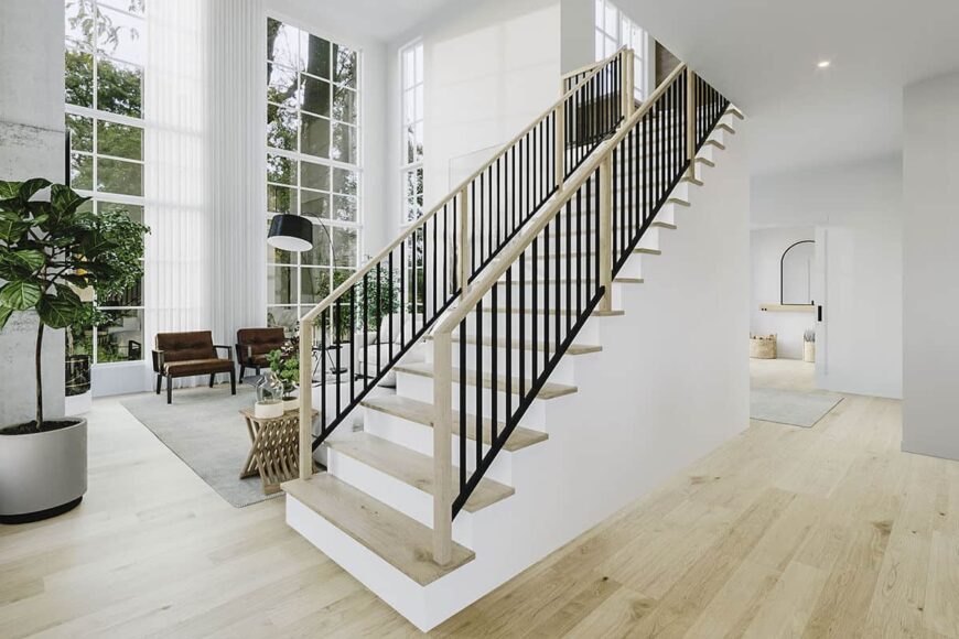 Another staircase leading to the upstairs bedrooms separates the main living spaces.