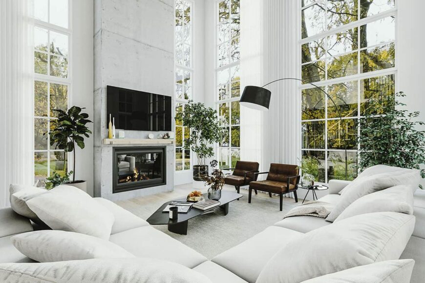 Floor-to-ceiling windows bathe the living room with ample natural light.