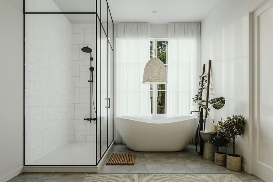 Primary bathroom with a walk-in shower and a freestanding tub topped by a wicker chandelier.