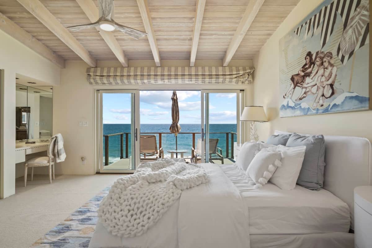 The primary suite has a built-in vanity and a private terrace with impressive ocean views. Image courtesy of Toptenrealestatedeals.com.