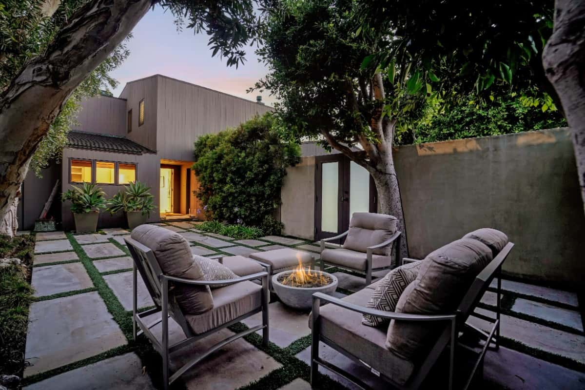 A firepit seating enhances the outdoor entertainment. Image courtesy of Toptenrealestatedeals.com.