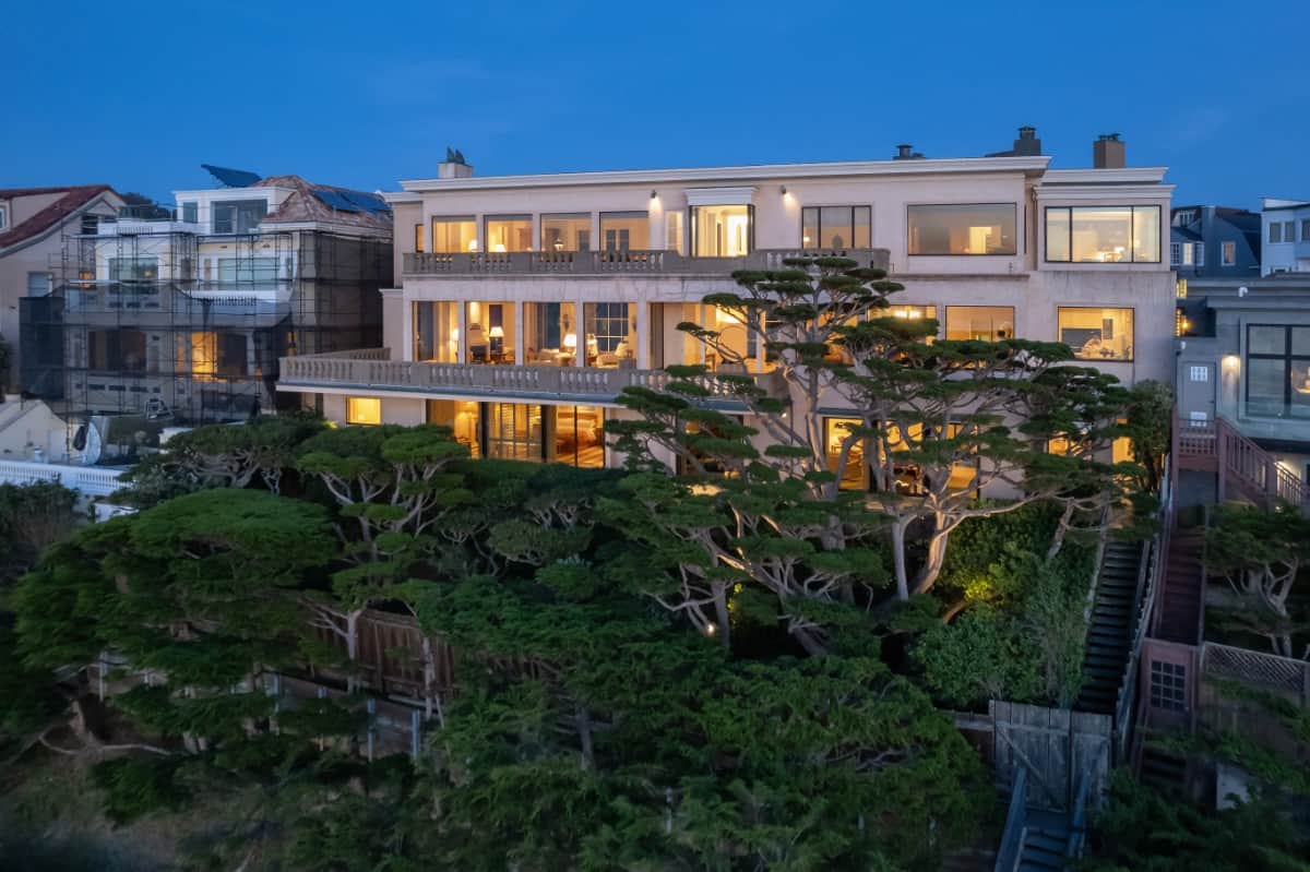 The sprawling mansion boasts expansive windows and walk-out terraces. Image courtesy of Toptenrealestatedeals.com.