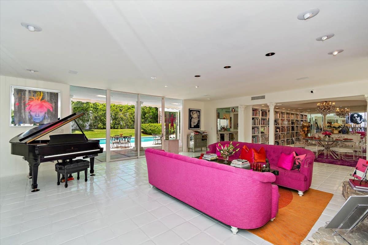 A couple of tufted pink sofas add a pop of color to the living room. Image courtesy of Toptenrealestatedeals.com.