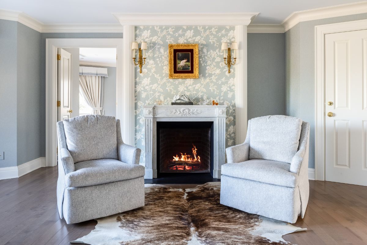 The vibrantly colored sitting room with a fireplace. Image courtesy of Toptenrealestatedeals.com