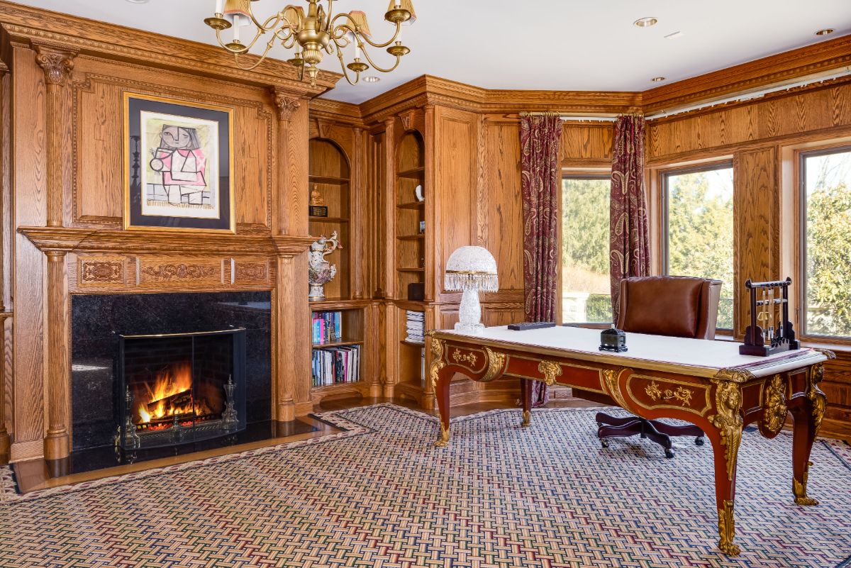 A sophisticated study with handsome oak paneling and a built-in wet bar. Image courtesy of Toptenrealestatedeals.com