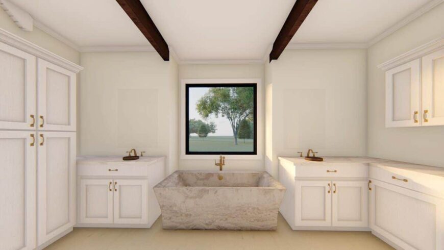 The primary bathroom has his and her sink vanities, full-height cabinets, and a freestanding tub highlighted by exposed beams.