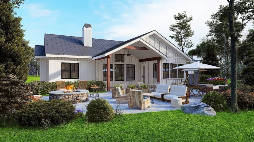 Rear rendering showcasing a gabled porch and a concrete patio with a fire pit sitting.